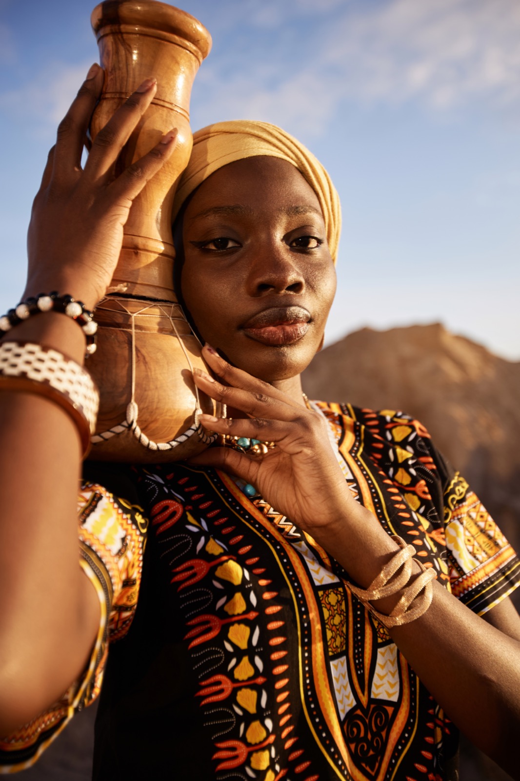 Woman holding a ceremonial vessel in nature